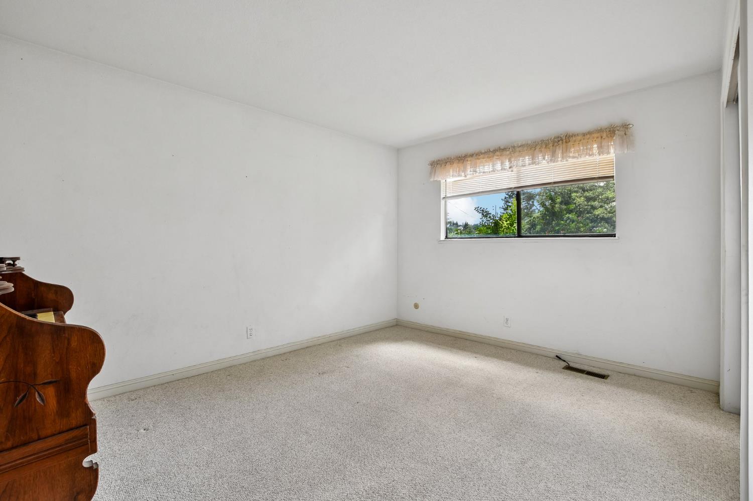 6180 Rustic Hills Drive Rocklin, CA 95677 - Photo 25 of 37 a view of an empty room with a window