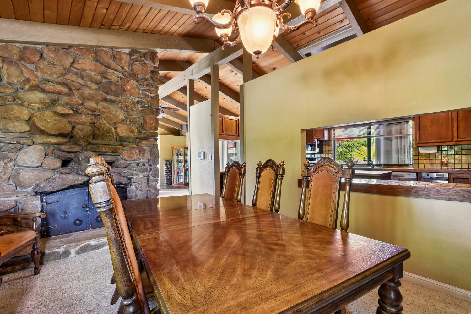 6180 Rustic Hills Drive Rocklin, CA 95677 - Photo 6 of 37 a dining room with furniture and wooden floor