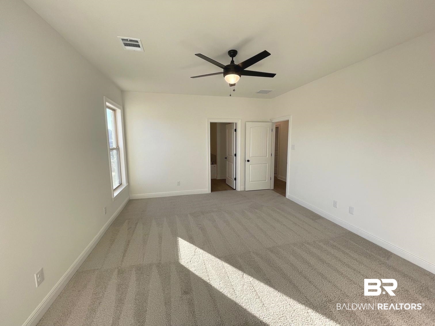 1363 Fenton Circle Foley, AL 36535 - Photo 7 of 20 Empty room featuring light colored carpet and ceiling fan