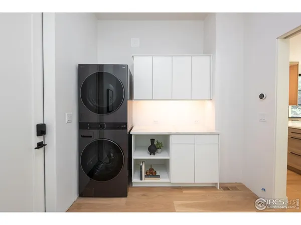 a utility room with sink dryer and washer