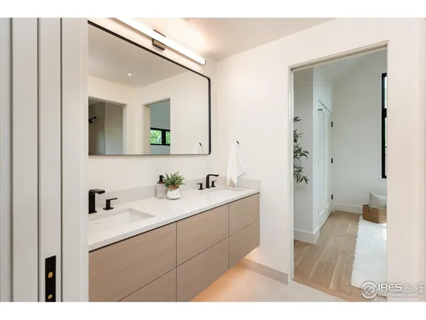 a en suite bathroom with a sink and mirror