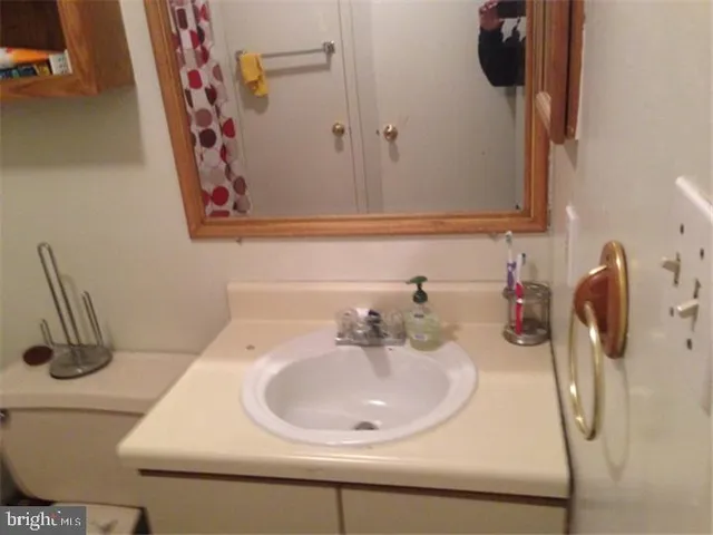 a bathroom with a sink and mirror