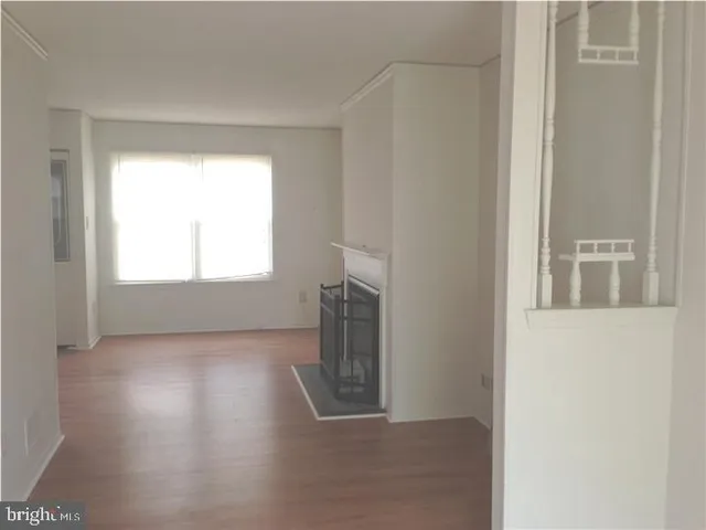 a view of an empty room and a window