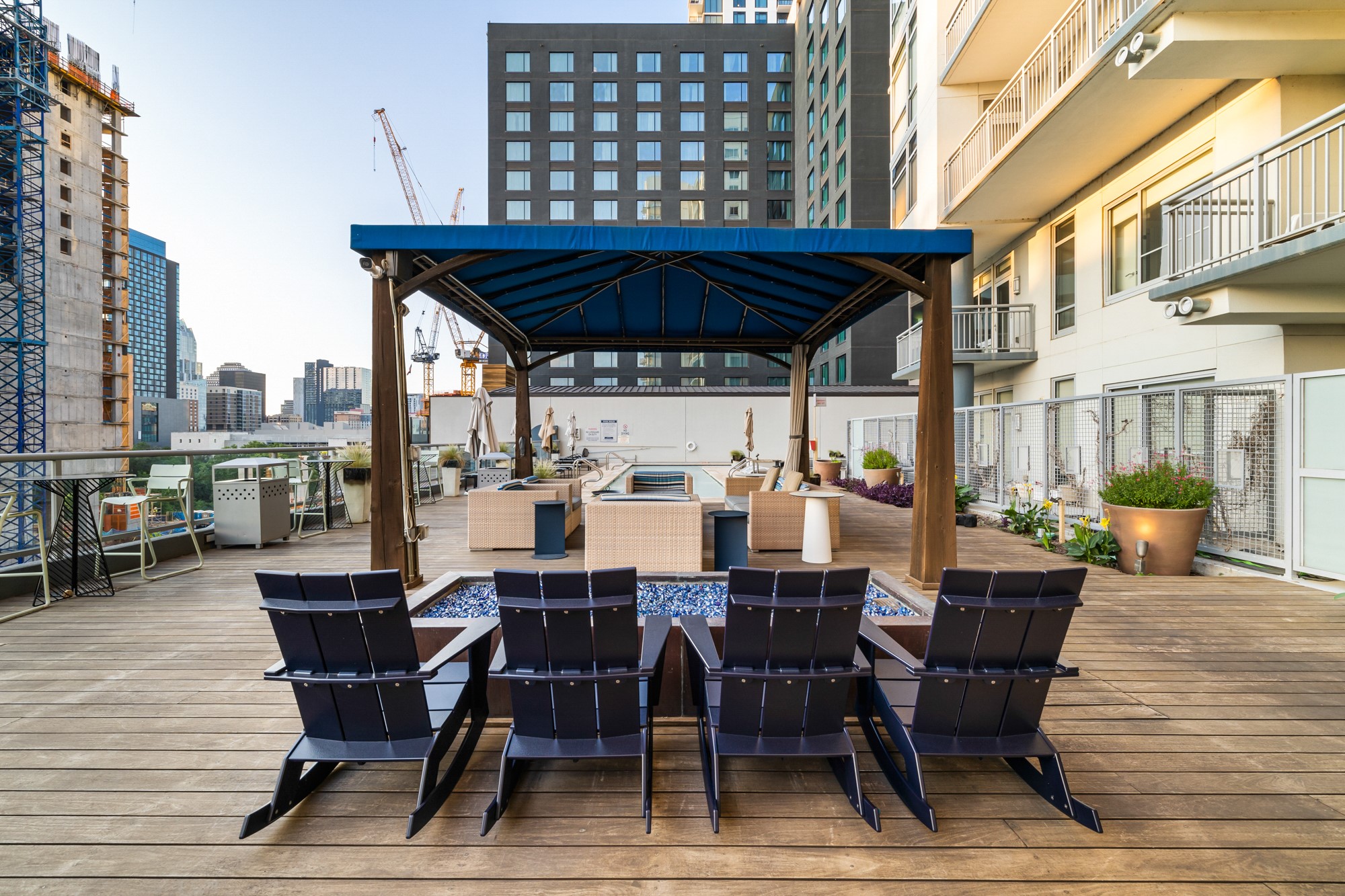 603 Davis Street, Unit 907 Austin, TX 78701 - Photo 21 of 22 Resort-style rooftop pool with plenty of lounge seating—an ideal spot to unwind just steps from Lady Bird Lake and the energy of the Rainey Street District.