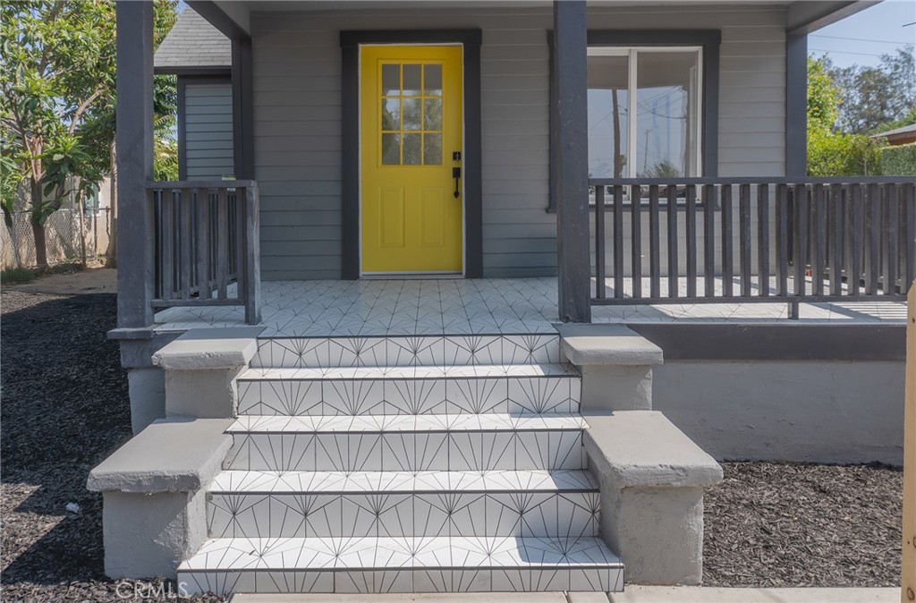 2158 Tenth Street Riverside, CA 92507 - Photo 1 of 24 a front view of a house with a yard