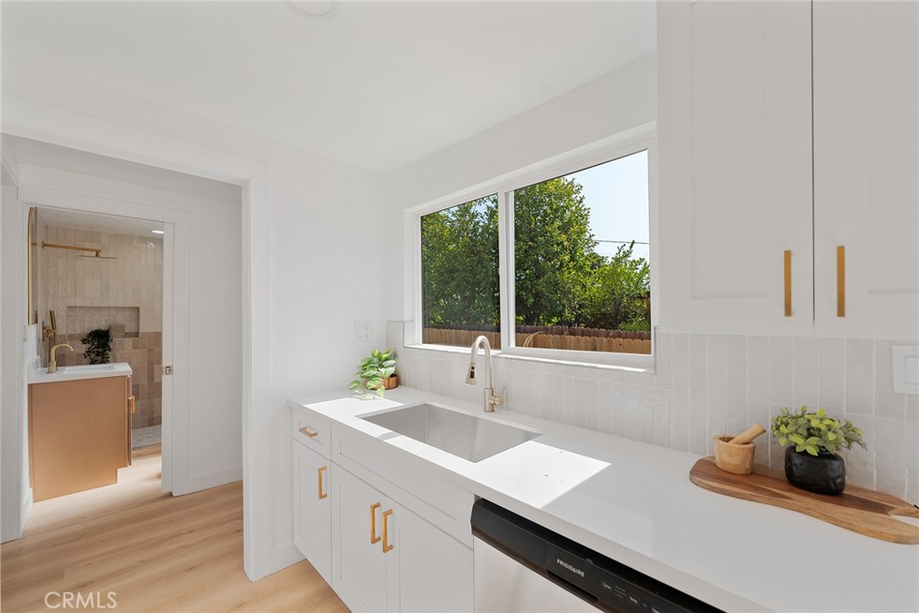 2158 Tenth Street Riverside, CA 92507 - Photo 15 of 24 a kitchen with a sink and large window