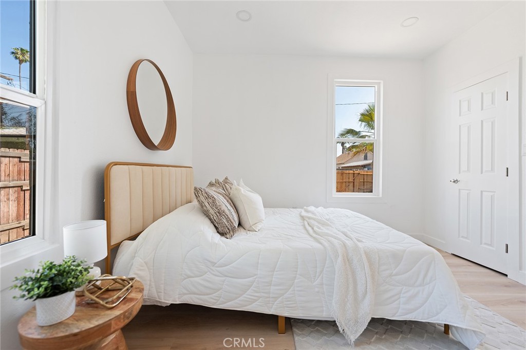 2158 Tenth Street Riverside, CA 92507 - Photo 17 of 24 a bedroom with a bed and a window