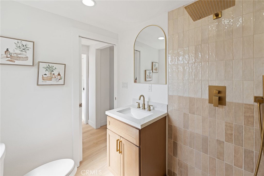 2158 Tenth Street Riverside, CA 92507 - Photo 19 of 24 a bathroom with a sink toilet and mirror