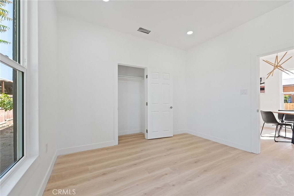 2158 Tenth Street Riverside, CA 92507 - Photo 20 of 24 wooden floor in an empty room with a window