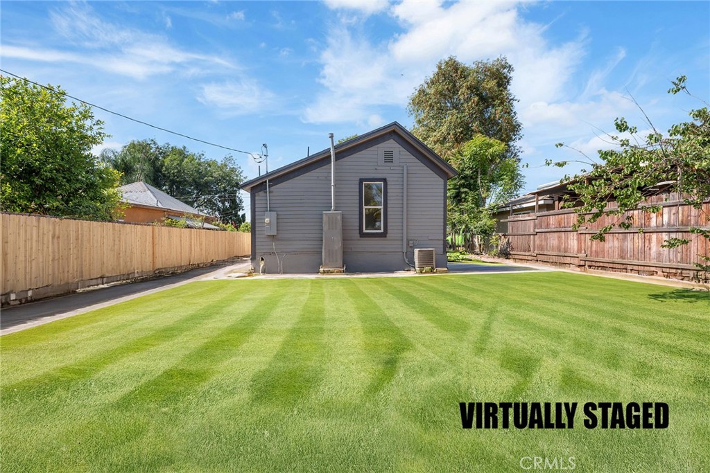 2158 Tenth Street Riverside, CA 92507 - Photo 24 of 24 a view of a backyard with barn and wooden fence
