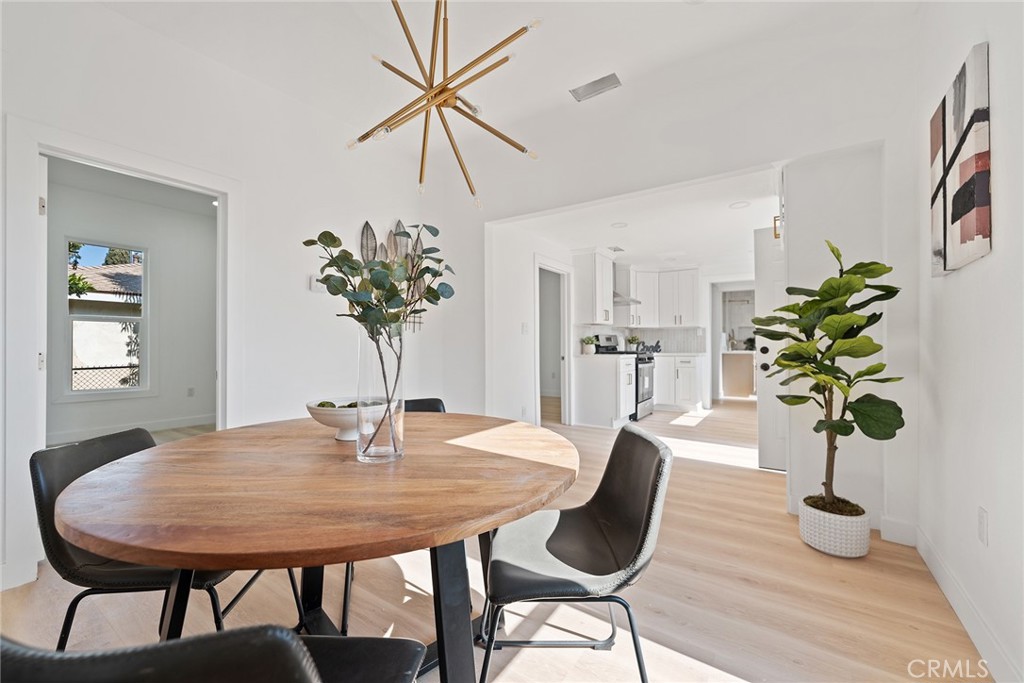 2158 Tenth Street Riverside, CA 92507 - Photo 4 of 24 a view of a dining room with furniture and wooden floor