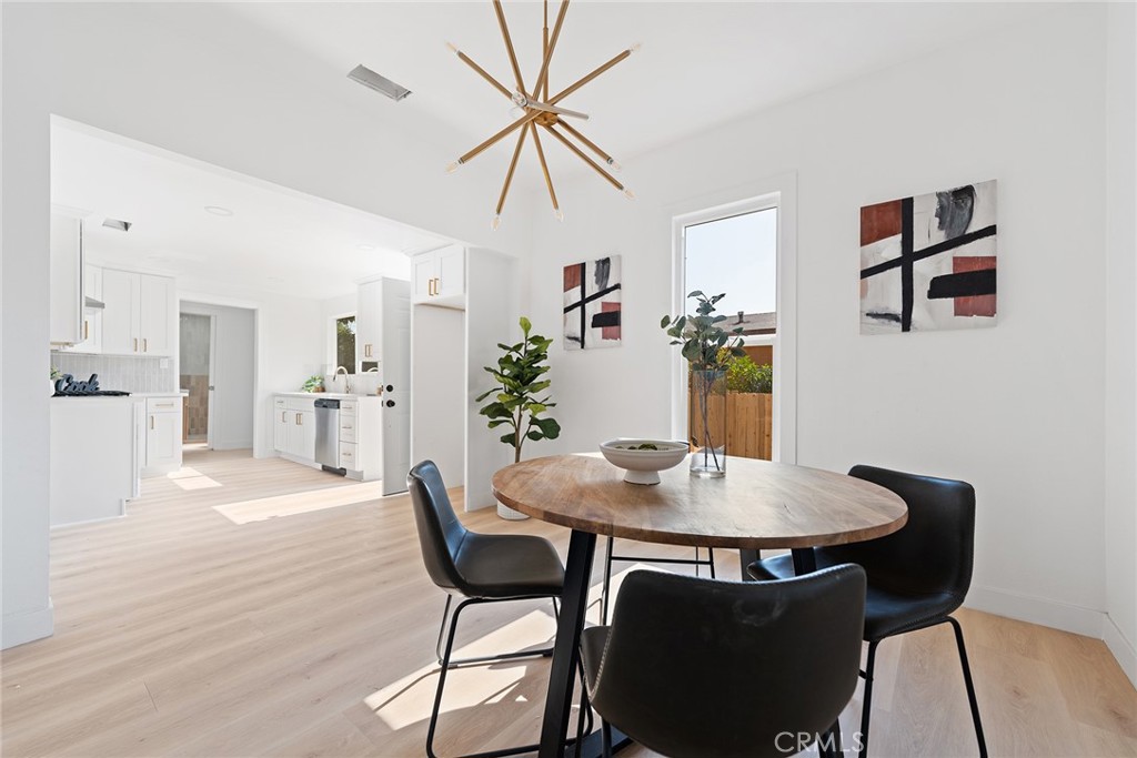 2158 Tenth Street Riverside, CA 92507 - Photo 5 of 24 a view of a dining room with furniture and wooden floor