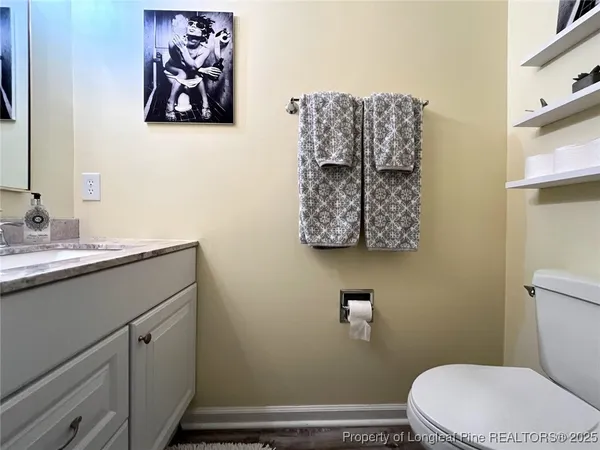 a bathroom with a toilet and a sink