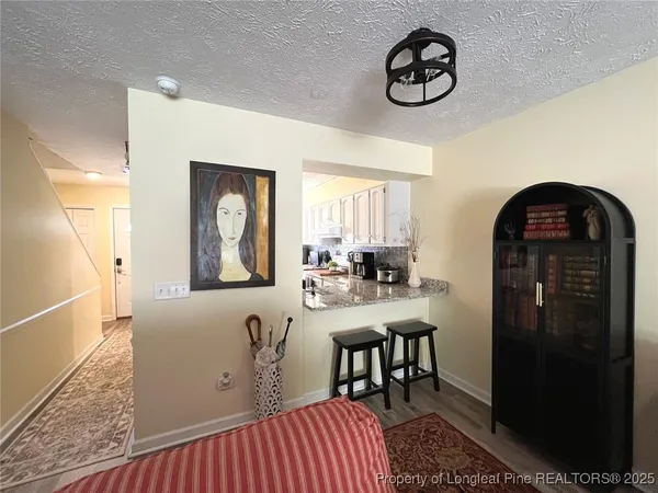 a view of a livingroom with furniture and window