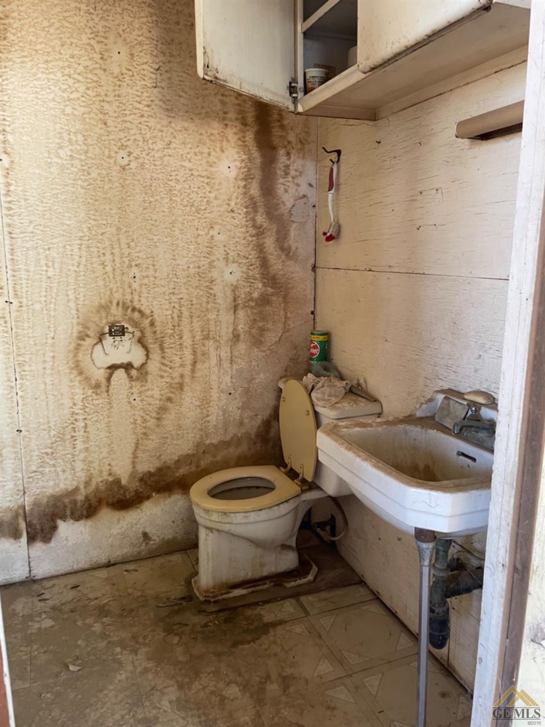 Undisclosed Address Bakersfield, CA 93307 - Photo 25 of 35 1/2 bath on back side of outside office...