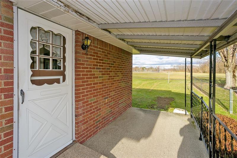 720 Cemetery Road Perryopolis, PA 15473 - Photo 18 of 19 Side porch is a great place to relax