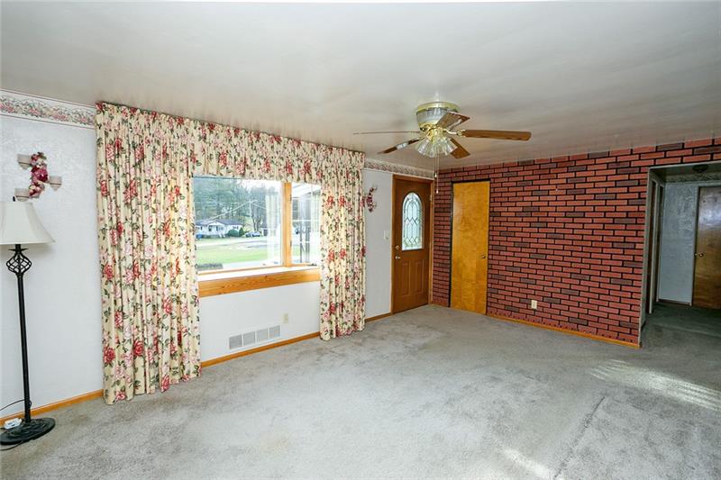 720 Cemetery Road Perryopolis, PA 15473 - Photo 5 of 19 Cozy living room with large bay window