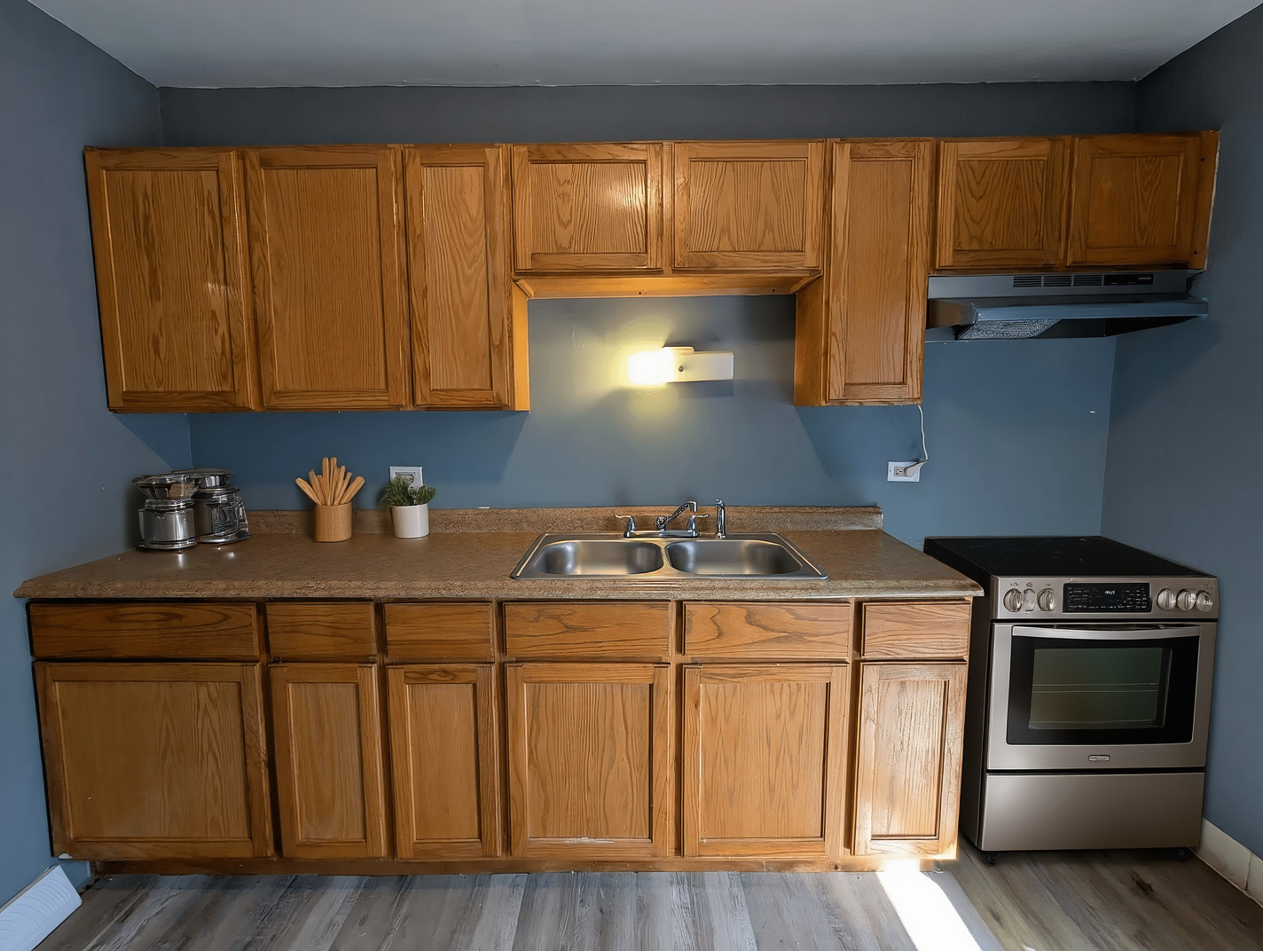11530 South Racine Avenue Chicago, IL 60643 - Photo 5 of 17 a kitchen with a sink a stove and cabinets