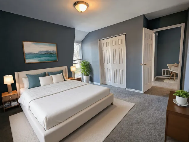 a bedroom with bed and window