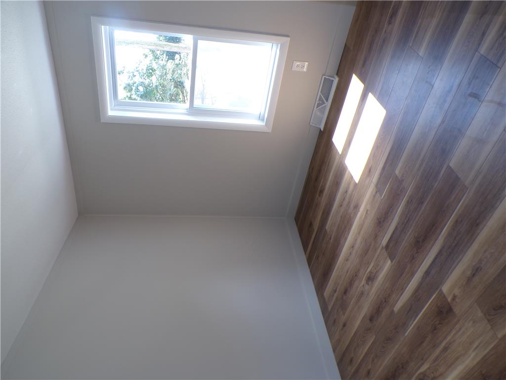 7877 Gun Club Road New Tripoli, PA 18066 - Photo 10 of 19 Natural light illuminates rich hardwood flooring within this versatile space.