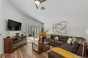 a living room with furniture and a flat screen tv