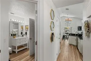 a view of living room and kitchen with furniture wooden floor and window