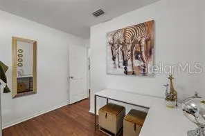 a view of a room with wooden floor and closet