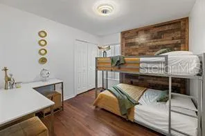 a bedroom with a bed and a table in it