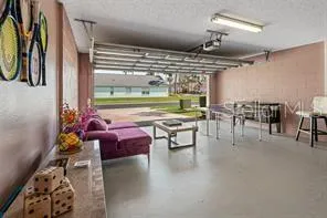 a outdoor space with lots of furniture and lots of tables