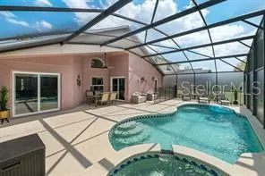 a view of a porch with furniture and a yard
