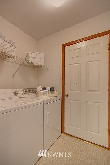 3320 201st Place Southeast Bothell, WA 98012 - Photo 14 of 18 a utility room with dryer and washer