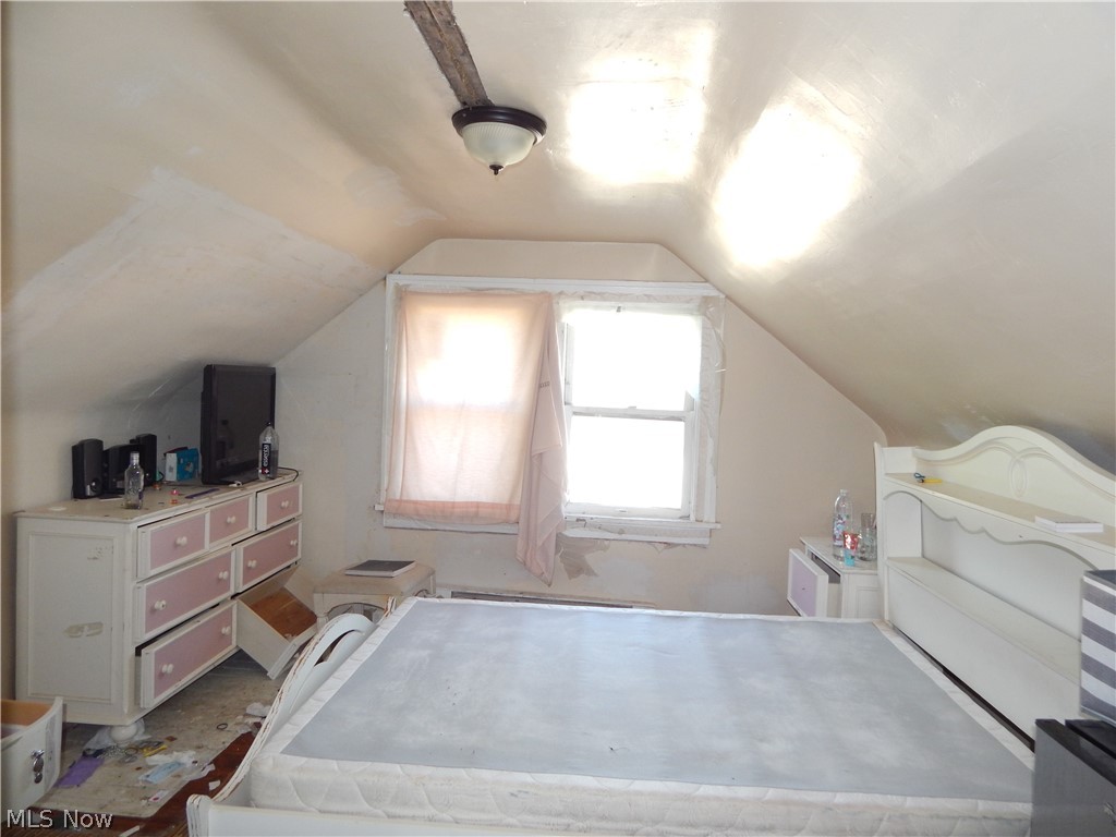 976 Paxton Road Cleveland, OH 44108 - Photo 18 of 22 3rd floor living space featuring vaulted ceiling