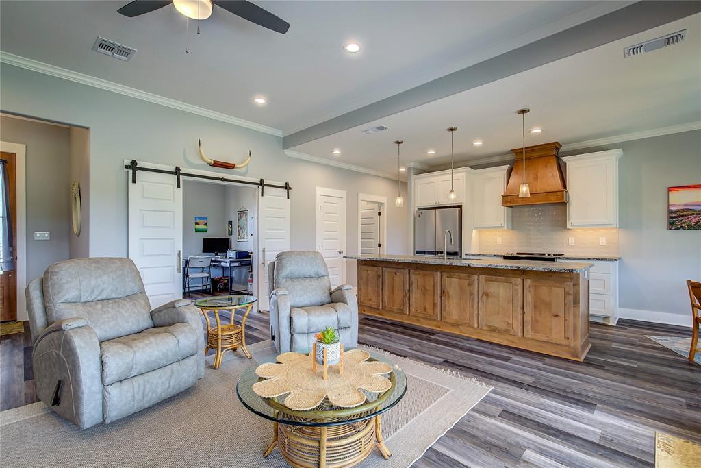 326 Koby Circle Sulphur Springs, TX 75482 - Photo 8 of 38 Living room with view of kitchen; look at all those gorgeous 6-panel doors!