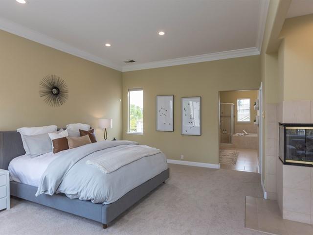 7209 Emami Drive San Jose, CA 95120 - Photo 17 of 33 a spacious bedroom with a bed and glass door