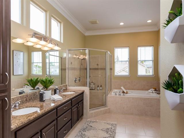 7209 Emami Drive San Jose, CA 95120 - Photo 18 of 33 a bathroom with a granite countertop tub a double vanity sink and a large mirror