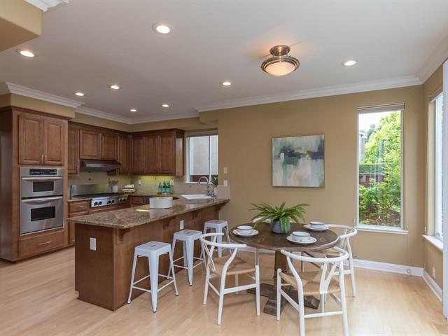 7209 Emami Drive San Jose, CA 95120 - Photo 8 of 33 a kitchen with stainless steel appliances granite countertop a stove a sink a counter space and chairs