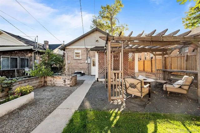 a view of a pathway with a wooden fence