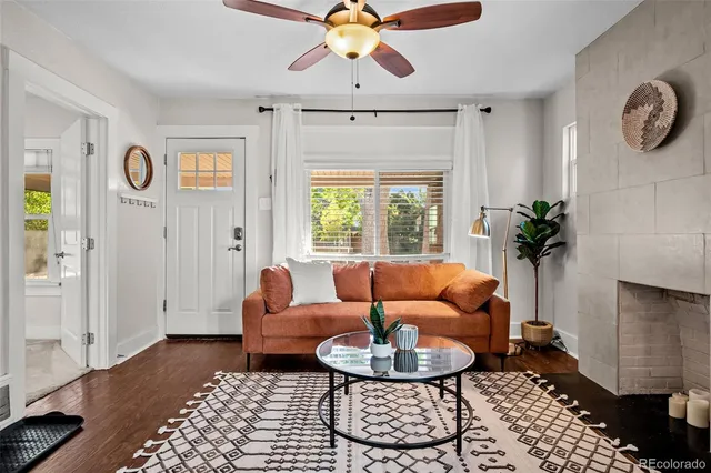 a living room with furniture and a rug