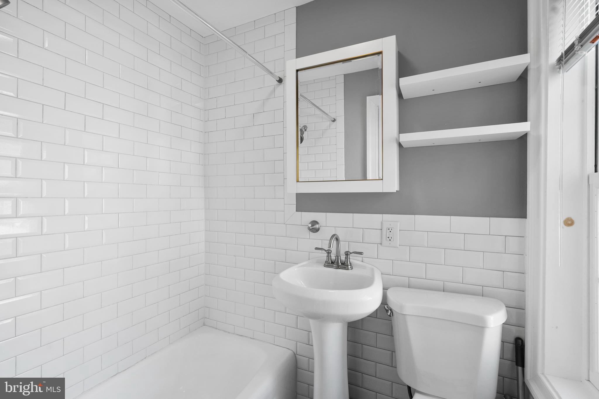 109 Mercer Street Newtown, PA 18940 - Photo 13 of 26 a bathroom with a sink and mirror