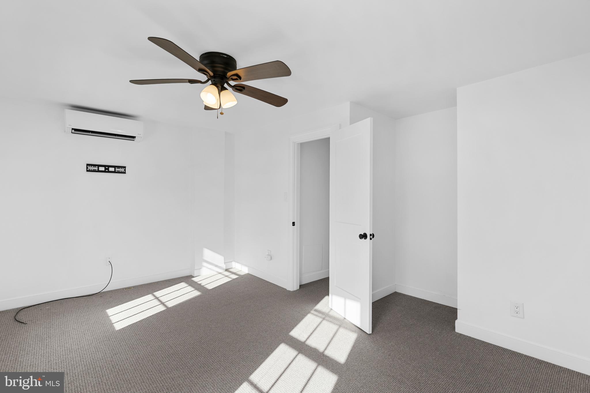 109 Mercer Street Newtown, PA 18940 - Photo 16 of 26 a view of a livingroom with a ceiling fan and window