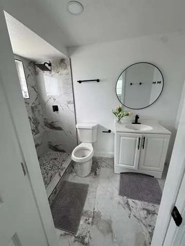 a view of a hallway with seating area