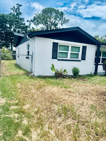 a house view with a garden space
