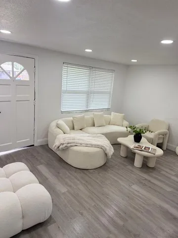 a kitchen with stainless steel appliances a stove a sink and a refrigerator