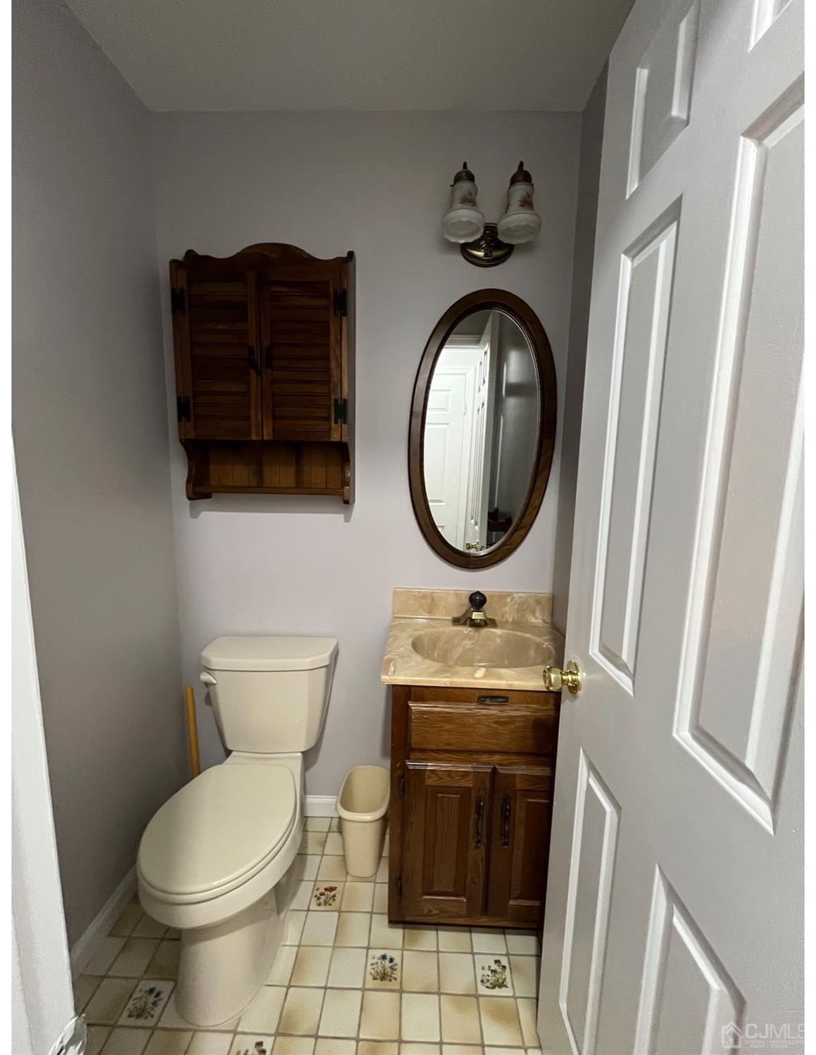 23 Pendleton Place Old Bridge, NJ 08857 - Photo 8 of 14 a bathroom with a toilet a sink and a mirror
