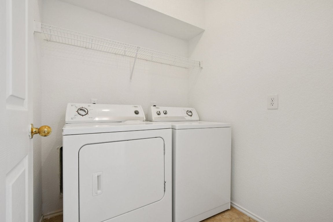 14504 Harris Ridge Boulevard, Unit A Pflugerville, TX 78660 - Photo 13 of 23 a utility room with dryer and washer