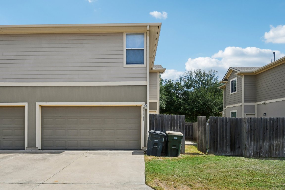 14504 Harris Ridge Boulevard, Unit A Pflugerville, TX 78660 - Photo 19 of 23 a front view of house with a garden
