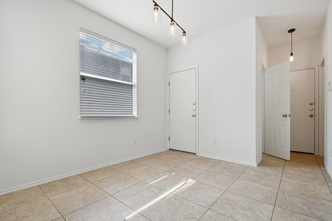 14504 Harris Ridge Boulevard, Unit A Pflugerville, TX 78660 - Photo 10 of 23 a view of an empty room with closet and a window