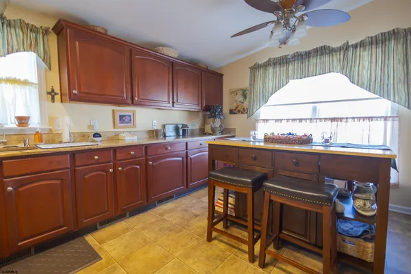 a kitchen with a sink cabinets and window