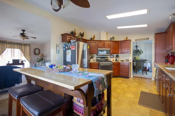 a kitchen with a table and chairs in it