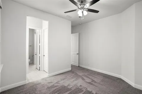 an empty room with a view of a bathroom